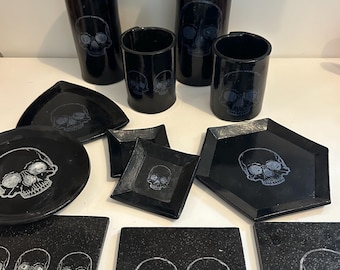 ceramic skull plates, dish and candle holder, vase