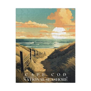 May include: A vintage-style illustration of a path leading to a beach with a sunset and a large, bright sun in the sky. The text "CAPE COD NATIONAL SEASHORE MASSACHUSETTS MA" is at the bottom of the image.