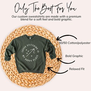 May include: An olive green sweatshirt with the text "Cross Stitching is My Happy Place" in a white circular design. The image also includes the text "Only The Best For You" and "Our custom sweatshirts are made with a premium blend for a soft feel and bold graphic."