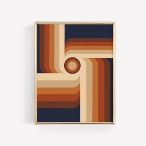 May include: Framed abstract art print featuring a retro design. The artwork showcases a geometric pattern of curved lines in shades of brown, beige, and orange against a dark blue background. A central circle completes the design. The frame is gold.