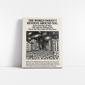 May include: A black and white print with the text "THE WORLD DOESN'T REVOLVE AROUND YOU." The image depicts a city scene with a crowd of people and a galaxy in the sky. Additional text is included below the image.