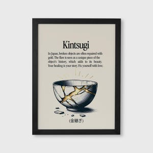 May include: Black framed print featuring the word "Kintsugi" above a description of the Japanese art of repairing broken objects with gold. The image includes a bowl with gold-filled cracks and the Japanese characters for Kintsugi.