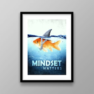 May include: Framed art print featuring a goldfish wearing a shark fin and harness, swimming in blue water. The words "MINDSET MATTERS" are displayed in large, white letters. The artwork is framed in a black border.