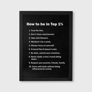 May include: Black framed print with white text that reads "How to be in Top 1%" followed by a list of ten rules. The print is on a white background.