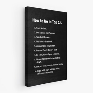 May include: A black canvas print with white text that reads "How to be in Top 1%" followed by a numbered list of ten points. The print has a textured appearance and is displayed at an angle against a white background.