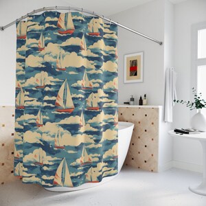 May include: A shower curtain with a nautical theme featuring a repeating pattern of sailboats and clouds on a blue and beige background.
