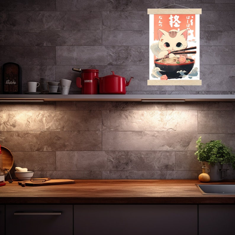 May include: A poster with a cartoon cat eating ramen noodles. The poster is in Japanese and says "Ramen" and "Cat". The poster is hanging on a wall in a kitchen.