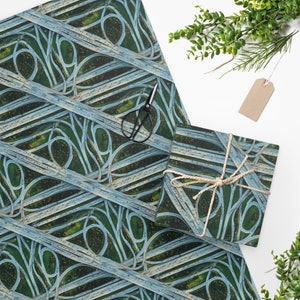 May include: A green and blue wrapping paper with a repeating pattern of an aerial view of a highway interchange.