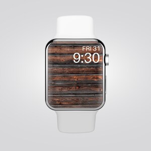 May include: A white smartwatch with a silver frame and a wood-grain background on the screen. The time is 9:30 and the date is FRI 31.
