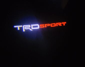 Bright TR&#39;Ds SPORT   Welcome Lights 2Pcs Entry LED Logo Light Car Adjustable Angles [Bright]