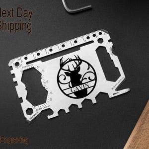 May include: A silver multi-tool with a bottle opener, ruler, and a deer silhouette with the name "Gavin" engraved in a circle.