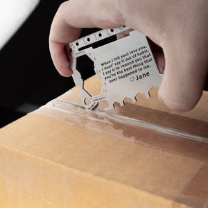 May include: A silver multi-tool with a ruler, bottle opener, and other tools. The tool has an engraved message that reads: "When I tell you I love you, I don't say it out of habit. I say it to remind you that you're the best thing that ever happened to me." The message is signed "Jane".