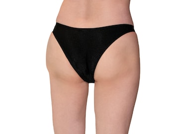 May include: Black underwear with a low-rise cut and a smooth, seamless finish.