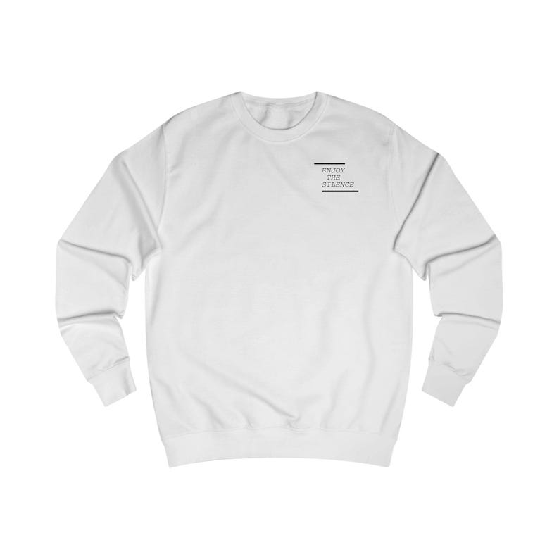 May include: White long-sleeve sweatshirt with the text "ENJOY THE SILENCE" printed on the front.