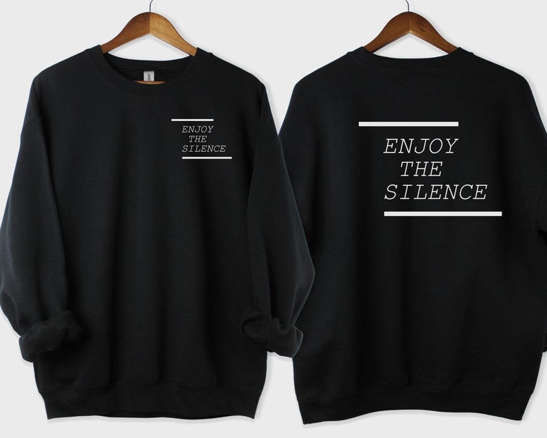May include: Black sweatshirt with the text "Enjoy the Silence" printed on the front and back in white.