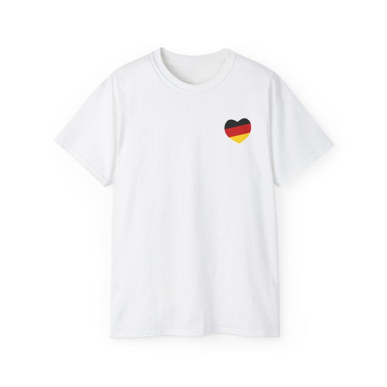 May include: White t-shirt with a small heart-shaped German flag design on the left chest.