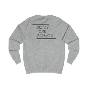 May include: A heather gray sweatshirt with the text "ENJOY THE SILENCE" printed on the back.