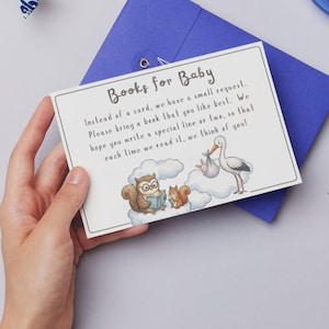 May include: A white ceramic mug with a black handle and the text "But First, Coffee" in a bold, black font. The mug is set against a blurred background, suggesting a cosy setting.