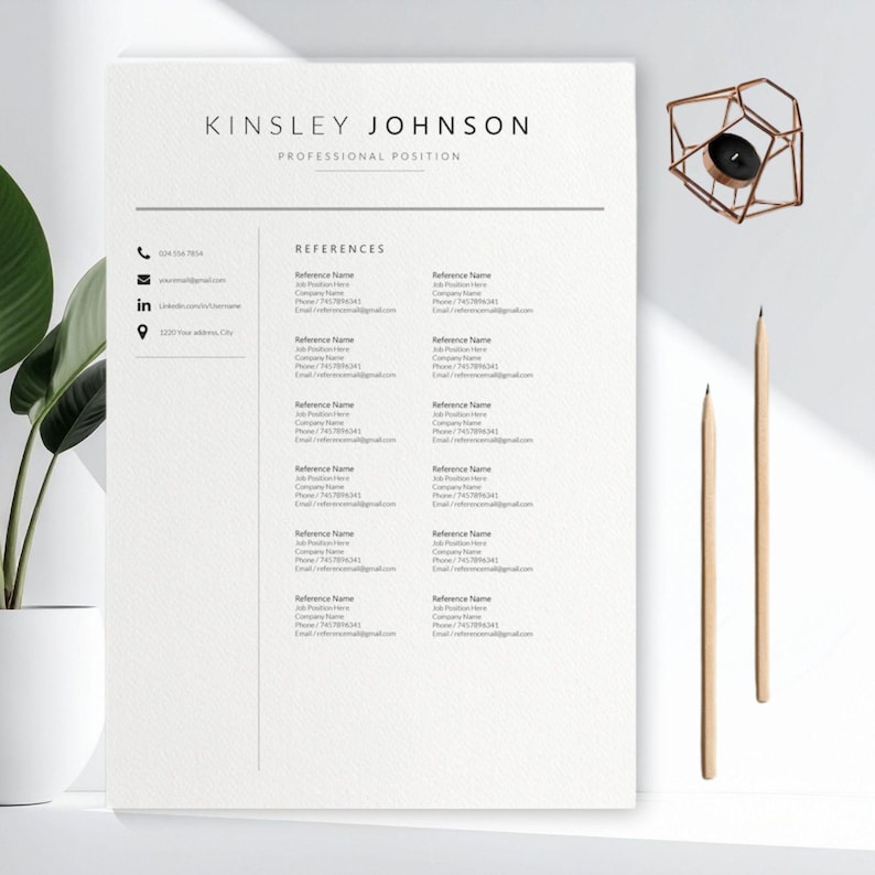 May include: A minimalist resume template with the name "KINSLEY JOHNSON" at the top, followed by "PROFESSIONAL POSITION." The document includes sections for contact information and references. Two pencils and a geometric candle holder are also visible.