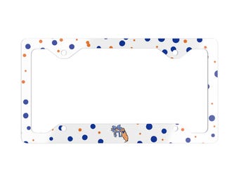 May include: A white rectangular license plate frame featuring a pattern of dark blue and orange polka dots. Centered at the bottom is a small graphic of a leopard wearing a blue and white checkered bow, positioned next to the letters FL.