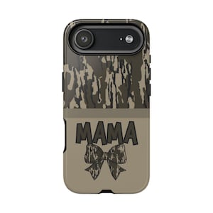 May include: A phone case with a camouflage pattern at the top and a tan bottom. The word "MAMA" is printed in dark gray, with a bow graphic below it. The case has a camera cutout.