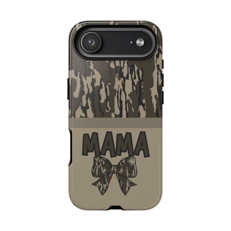 May include: A phone case with a camouflage pattern at the top and a tan bottom. The word "MAMA" is printed in dark gray, with a bow graphic below it. The case has a camera cutout.