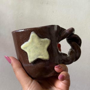 Rustic Brown Mug with 3D Star – Twisted Handle Pottery Cup