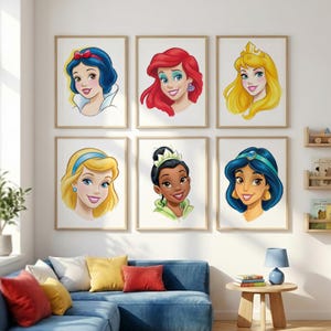 May include: Six framed art prints featuring watercolor portraits of Disney princesses. Each portrait showcases a different princess with vibrant colors and detailed facial features. The prints are displayed on a white wall above a blue sofa.