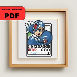 May include: A framed cross-stitch featuring Mega Man X in blue armor, with the text "MEGA MAN X" and game stats. The frame is light brown, and the image includes a red "Instant Download PDF" label.