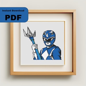 May include: Blue Power Ranger holding a blue and silver spear. The Power Ranger is wearing a blue helmet with a white diamond on the front. The background is white.