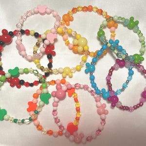 Mystery Mickey head, fish extender bracelets, lots of 5 or 10. Pixie dust, parties, thank you. All different varieties. Choose quantity