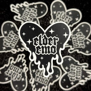 May include: Black and white sticker with a dripping heart shape. The heart has stars and the text "elder emo" inside.