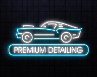 May include: A neon sign with a stylized car outline in white and blue. The text "PREMIUM DETAILING" is displayed in a blue, rounded rectangle below the car image. The background is a dark, textured surface.