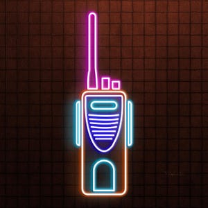May include: Neon sign depicting a walkie-talkie. The outline is orange, with blue and purple accents. The background is a dark brown brick wall. The walkie-talkie has a long antenna and a speaker.