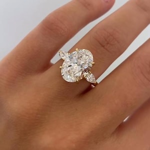 4.50 Carat IGI Certified Oval Cut Lab Created Three Stone Diamond Engagement Ring, Pear Cut Side Diamonds, 3 Stone Diamond Ring
