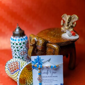 Handcrafted Rakhi Gift Hampers: Mosaic Hanging Lamps, Elephant Wooden Stool, Rakhis & Ganesh Statue A Perfect Blend of Art and Tradition image 6