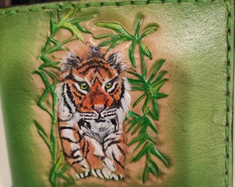 May include: A green leather wallet with a detailed embossed image of a tiger in a jungle setting.