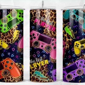 May include: Three different designs of a 20 oz. stainless steel tumbler with a leopard print background and a gamer controller design. The text "the best player" is on one of the tumblers.