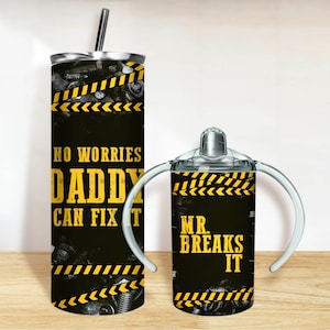 May include: Two stainless steel tumblers with black and yellow caution tape designs. The larger tumbler has the text "No worries Daddy can fix it". The smaller tumbler has the text "Mr. Breaks It".