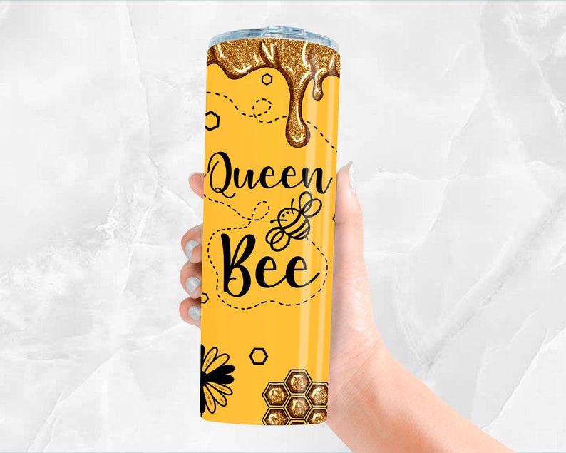 May include: A yellow tumbler with a gold glitter design and the text "Queen Bee" with a bee illustration.
