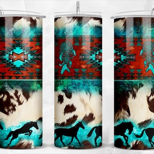 May include: A stainless steel tumbler with a turquoise, brown, and white design. The design features a Native American pattern, a dreamcatcher, and a cowhide pattern. The tumbler is decorated with silhouettes of horses running.
