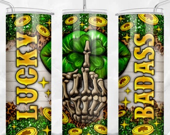 May include: A green, gold, and white tumbler with a skeleton hand giving the middle finger, a four-leaf clover, and the words "Lucky" and "Badass".