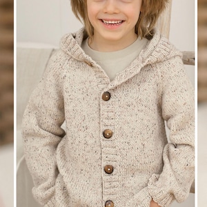 May include: A hooded, button-down cardigan sweater in a speckled beige knit. The sweater has large, round, brown buttons and is worn by a child. The sweater's hood is up, and the child is smiling.