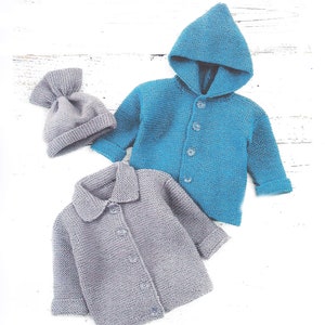 May include: Two knitted cardigans, one blue with a hood and one gray with a collar, and a gray knitted hat.