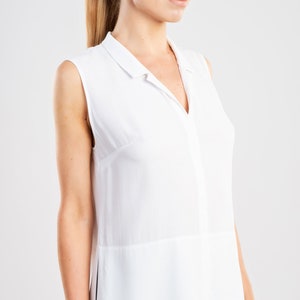 White asymmetric hem blouse