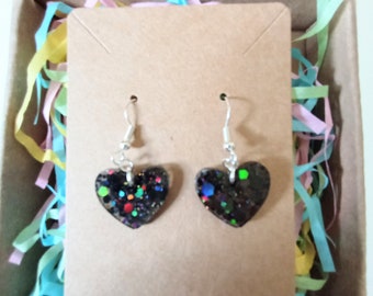 Black glittery resin heart earrings