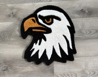 Alfombra artesanal con diseño de águila calva: decoración de pared que refleja el orgullo estadounidense.