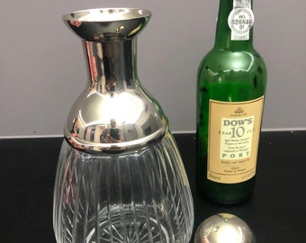 Hand-cut port - wine - whiskey decanter / carafe with silver-colored spout and heavy stopper.