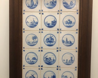 15 antique Delft blue tiles, made around 1898 in a handmade oak frame