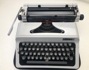 Neat looking Vintage Erika typewriter in case with QWERTY keyboard.